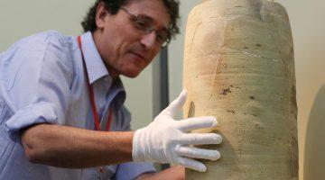 Dr. Adolfo Roitman, Curator of the Dead Sea Scrolls at The Israel Museum, Jerusalem shows the Scroll Jar during media preview of Temple, Scrolls and Divine Messengers: Archeology of the Land of Israel in Roman Times at Asia Society Hong Kong Center in Admiralty. 30OCT14