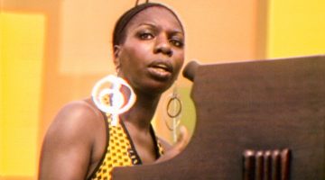 Nina Simone performs at the Harlem Cultural Festival in 1969, featured in the documentary SUMMER OF SOUL. Photo Courtesy of Searchlight Pictures. © 2021 20th Century Studios All Rights Reserved